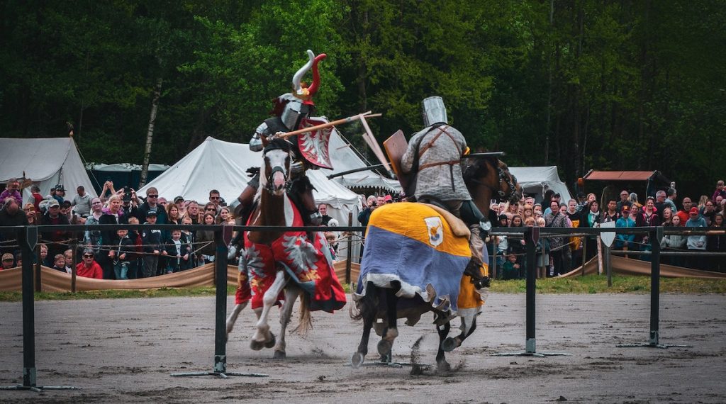 Image of knights on horseback jousting to symbolize how business owners need to stop political and religious jousting on Facebook and social media
