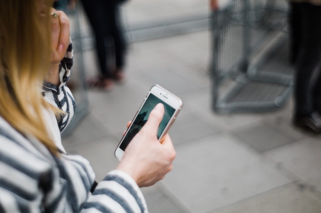 Photo of a phone caller to symbolize business owners contacting their clients by phone.